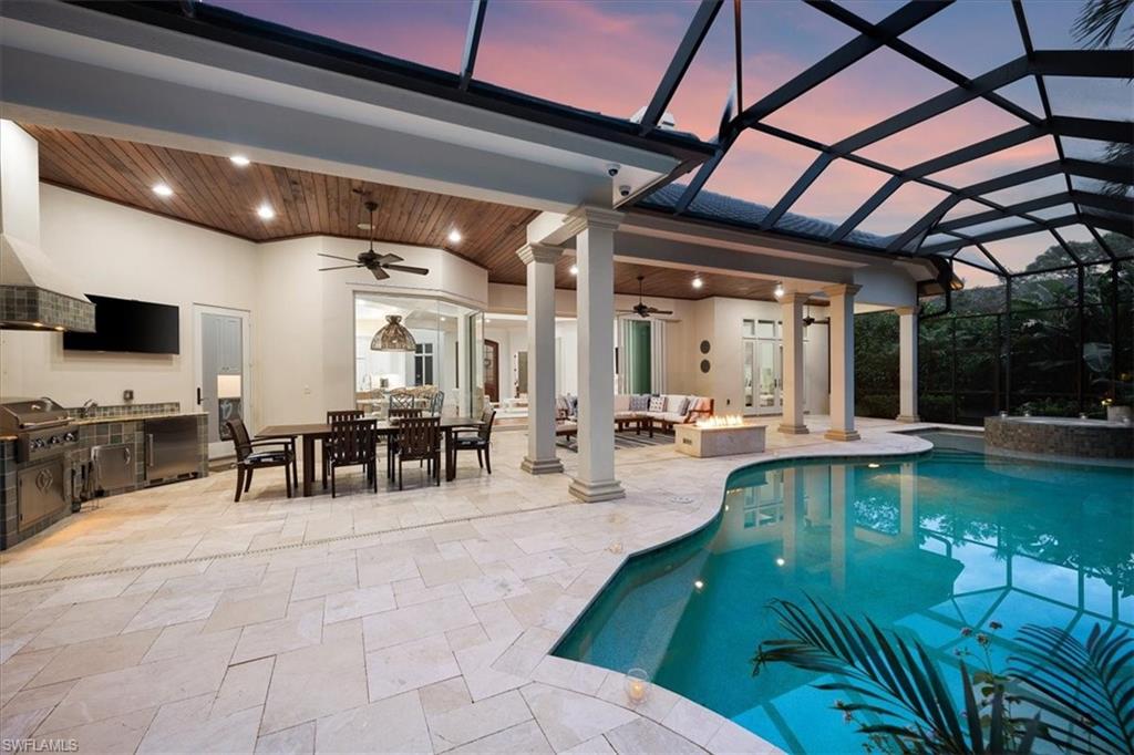 610 Springline Drive Naples, FL 34102 - Photo 5 of 49 a living room with lots of chairs and a table