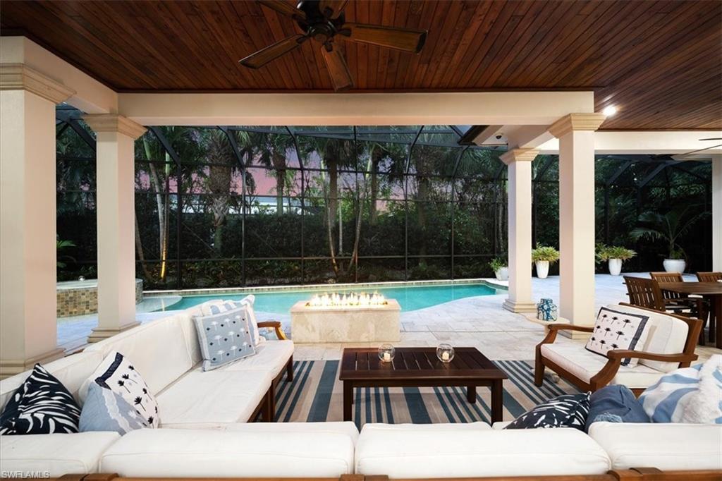 610 Springline Drive Naples, FL 34102 - Photo 8 of 49 a view of swimming pool with patio