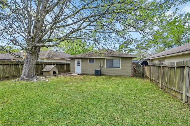 a house view with a sitting space and garden