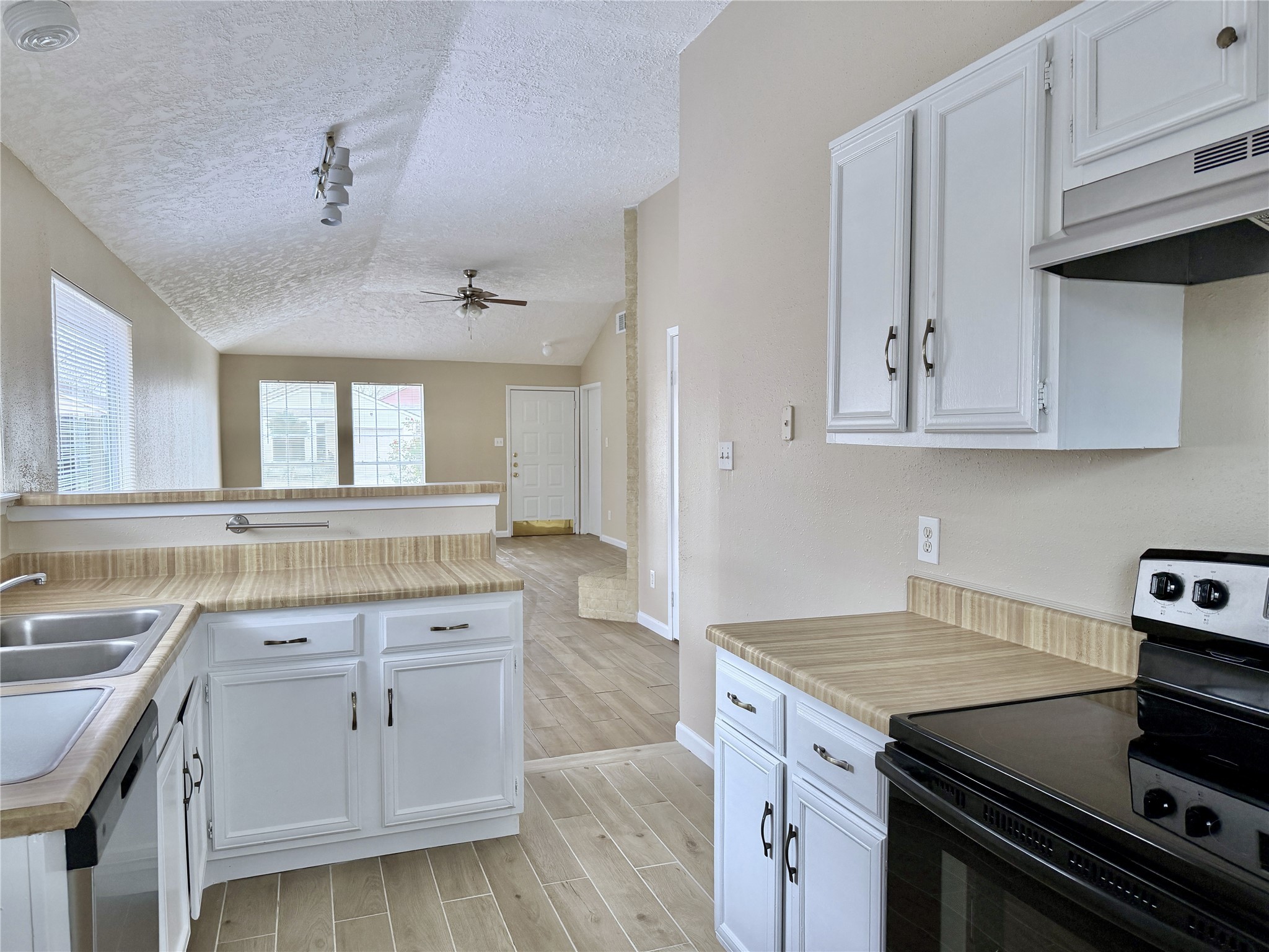 22112 Peachglen Lane Spring, TX 77373 - Photo 8 of 17 a kitchen with granite countertop a stove and a sink
