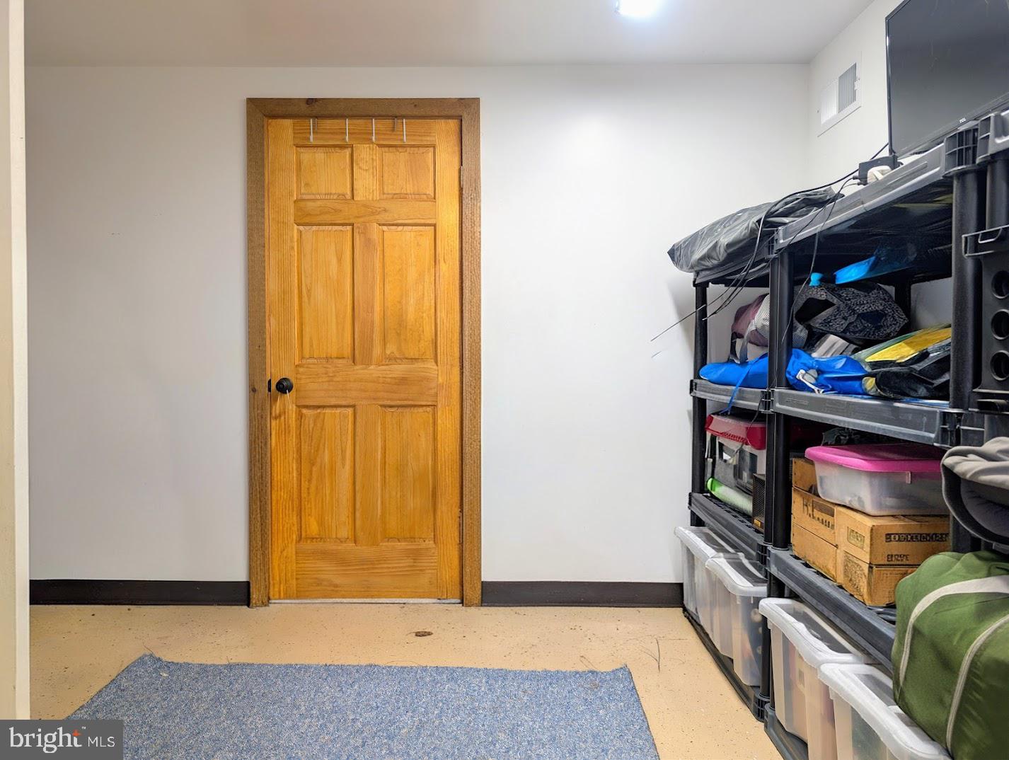 1030 Sandy Run Road Hopewell, PA 16650 - Photo 14 of 28 a view of an empty room with wooden floor and closet