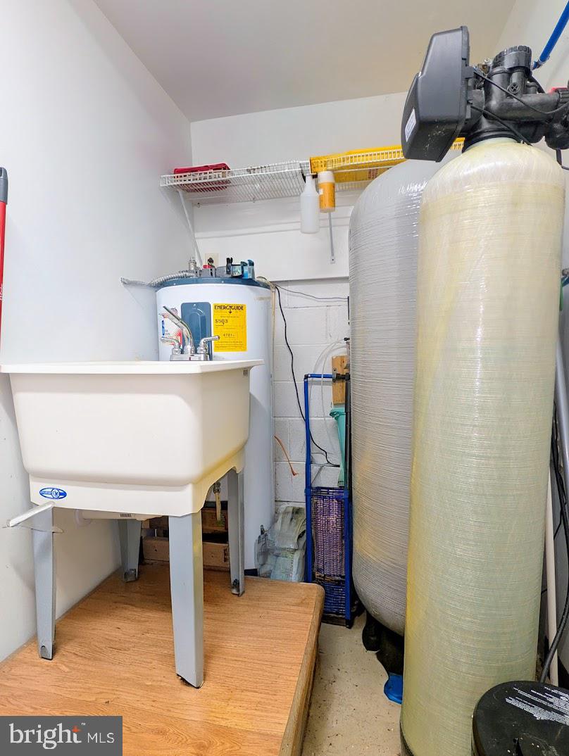 1030 Sandy Run Road Hopewell, PA 16650 - Photo 15 of 28 a workspace with a refrigerator and a sink