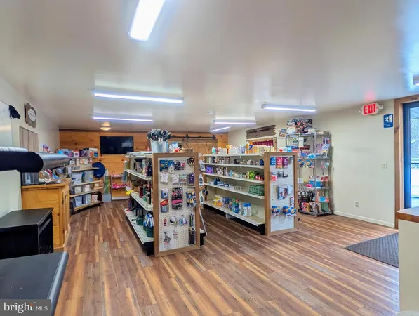 a living room with lots of furniture and baby crib