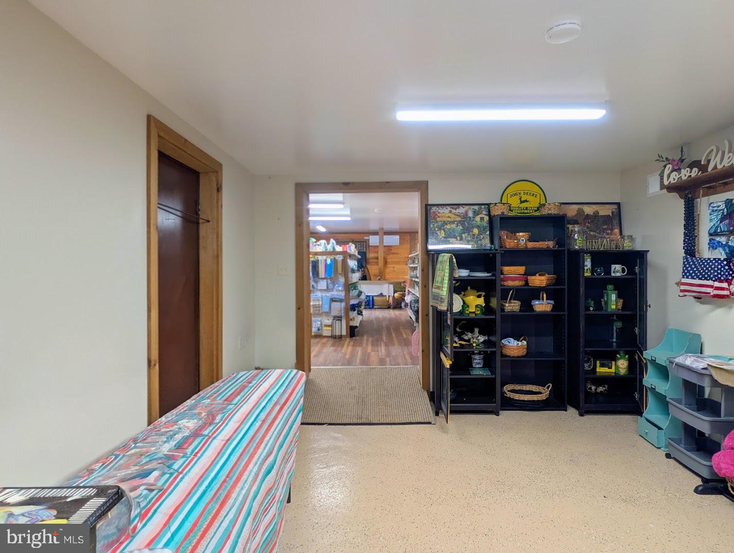 1030 Sandy Run Road Hopewell, PA 16650 - Photo 23 of 28 a living room with lots of furniture and baby crib