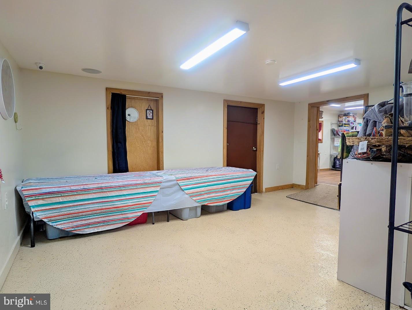 1030 Sandy Run Road Hopewell, PA 16650 - Photo 26 of 28 a room with a bed and a refrigerator