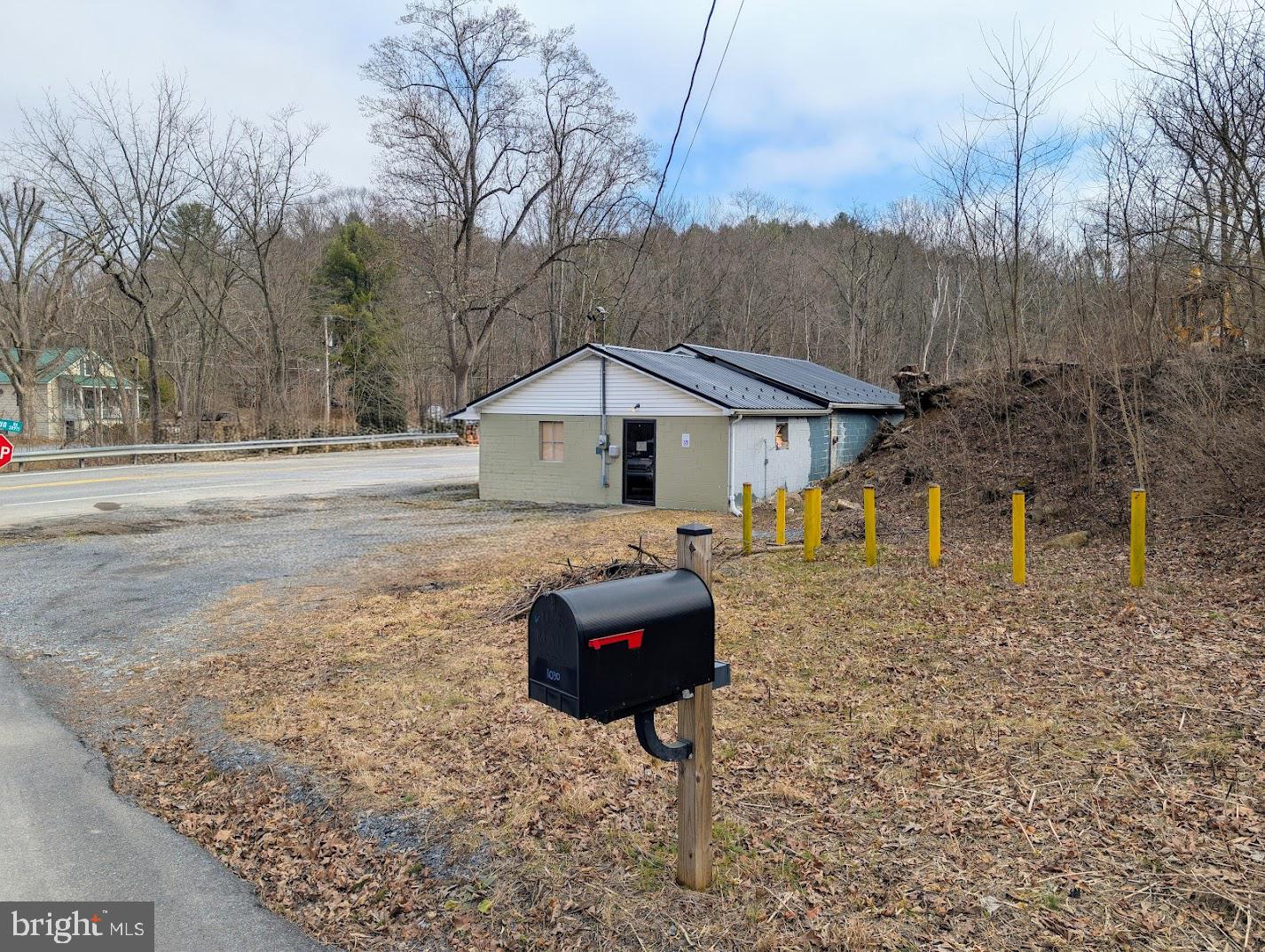 1030 Sandy Run Road Hopewell, PA 16650 - Photo 5 of 28 a front view of a house with a yard