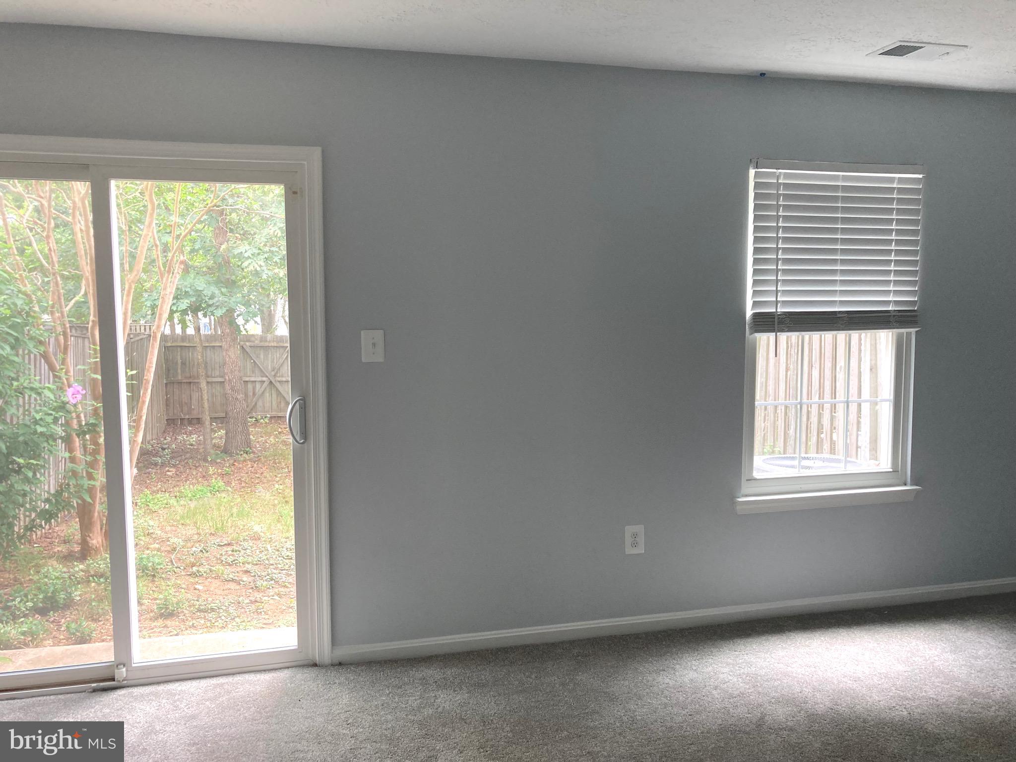 5775 Springfish Place Waldorf, MD 20603 - Photo 32 of 51 Basement rec room with Thompson Creek slider