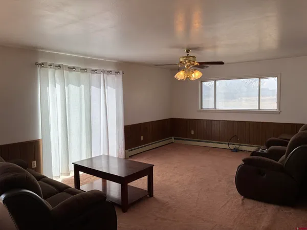 a living room with furniture and a window