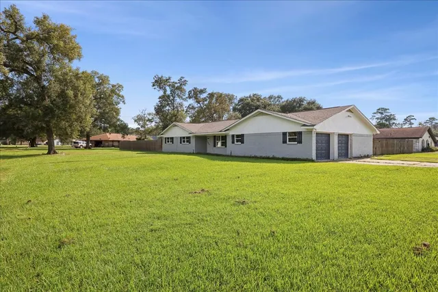 a front view of house with yard and seating area
