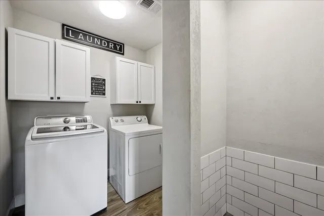 a view of storage and utility room with washer and dryer