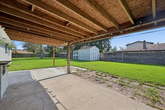 a view of a backyard with wooden floor