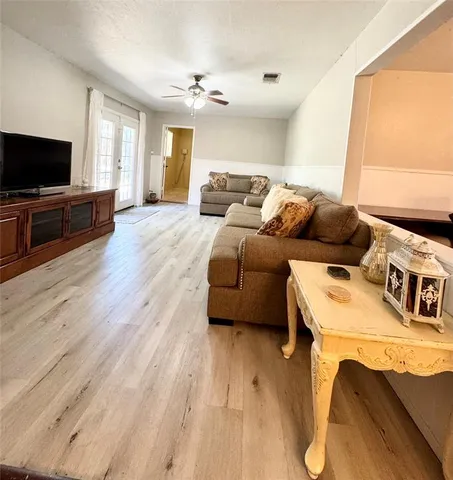 a living room with a couch and a flat screen tv