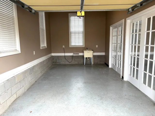 a view of a livingroom with furniture and window