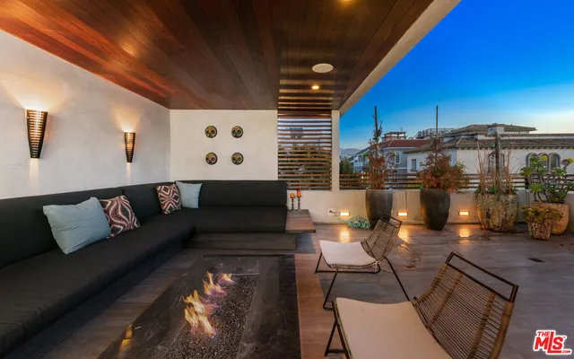 a bedroom with a bed a lamp and window