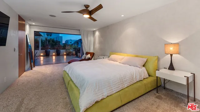 a view of a lobby with chair and a potted plant