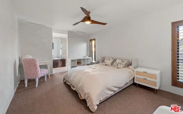 a bathroom with a sink a mirror and shower