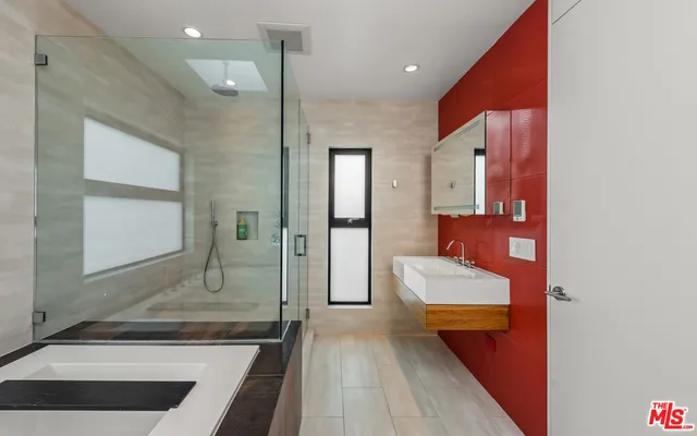 a bathroom with a bathtub and a sink