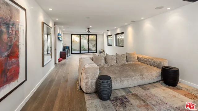a view of a porch with a table and chairs and potted plants