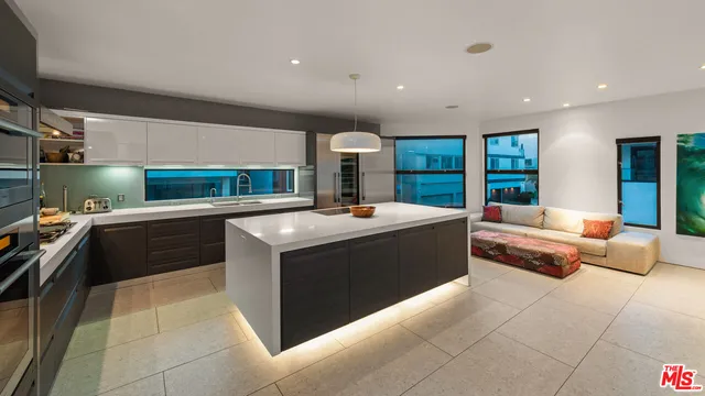 a stove top oven sitting inside of a kitchen
