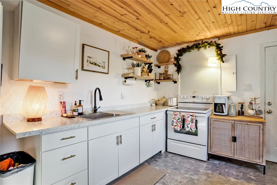 1670 Highway 194 Boone, NC 28607 - Photo 12 of 30 a kitchen with a sink and cabinets