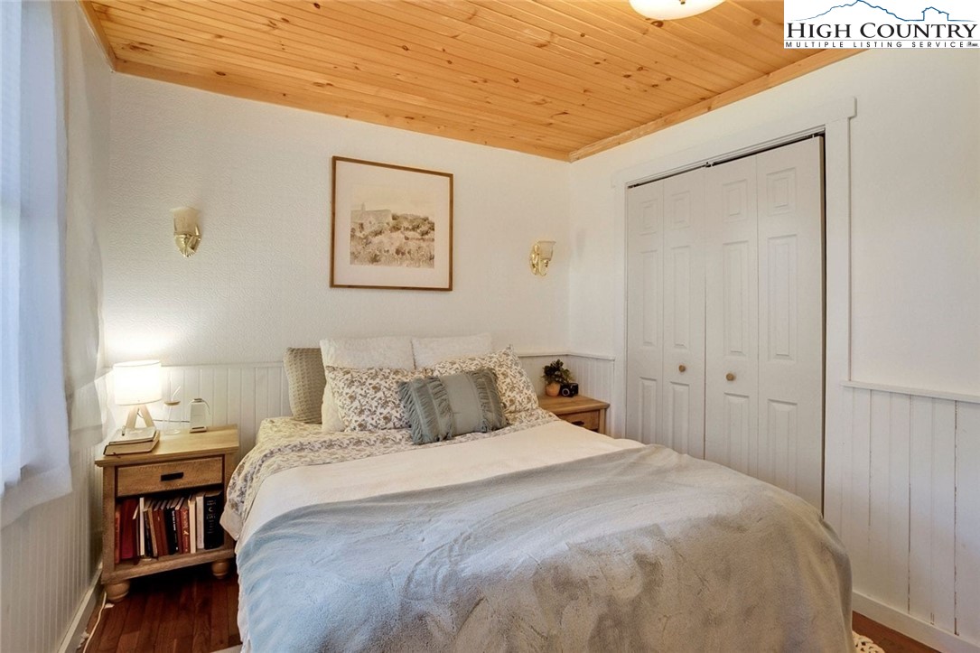 1670 Highway 194 Boone, NC 28607 - Photo 17 of 30 a bedroom with a bed and a table