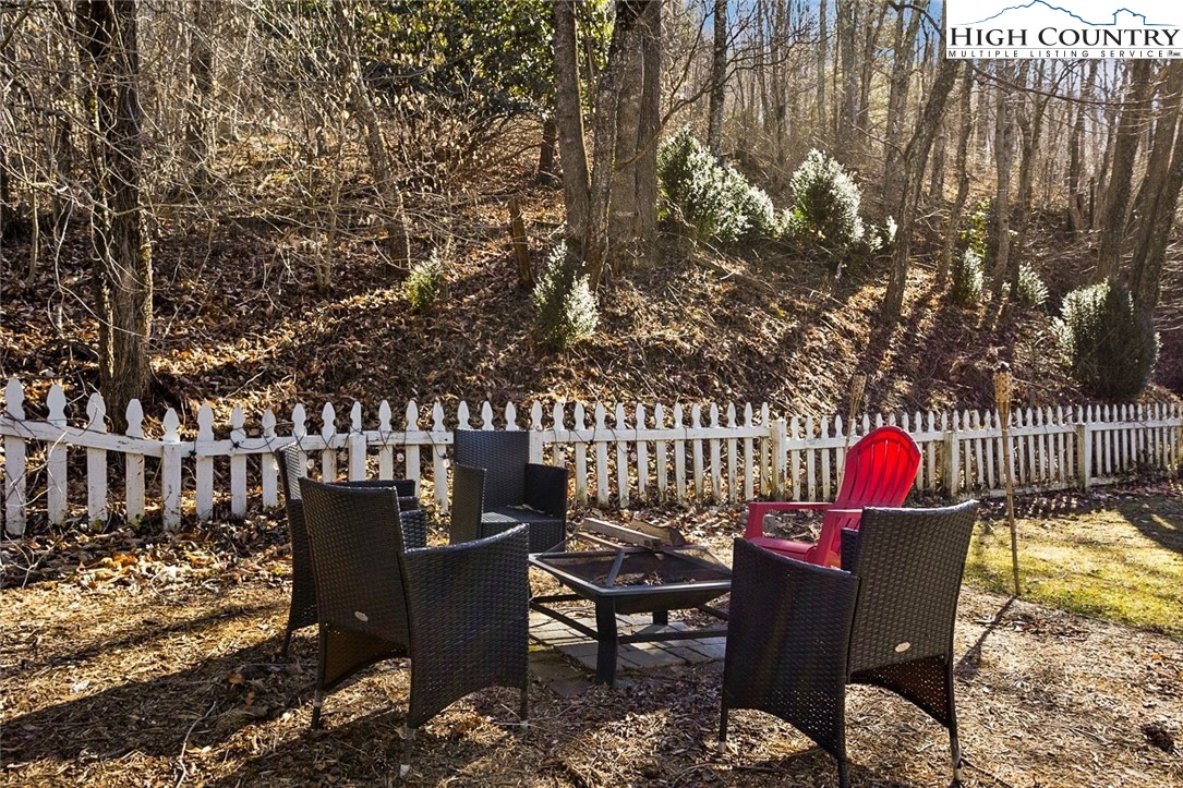 1670 Highway 194 Boone, NC 28607 - Photo 24 of 30 a backyard of a house with table and chairs