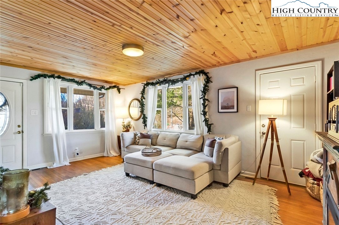 1670 Highway 194 Boone, NC 28607 - Photo 8 of 30 a living room with furniture and a wooden floor