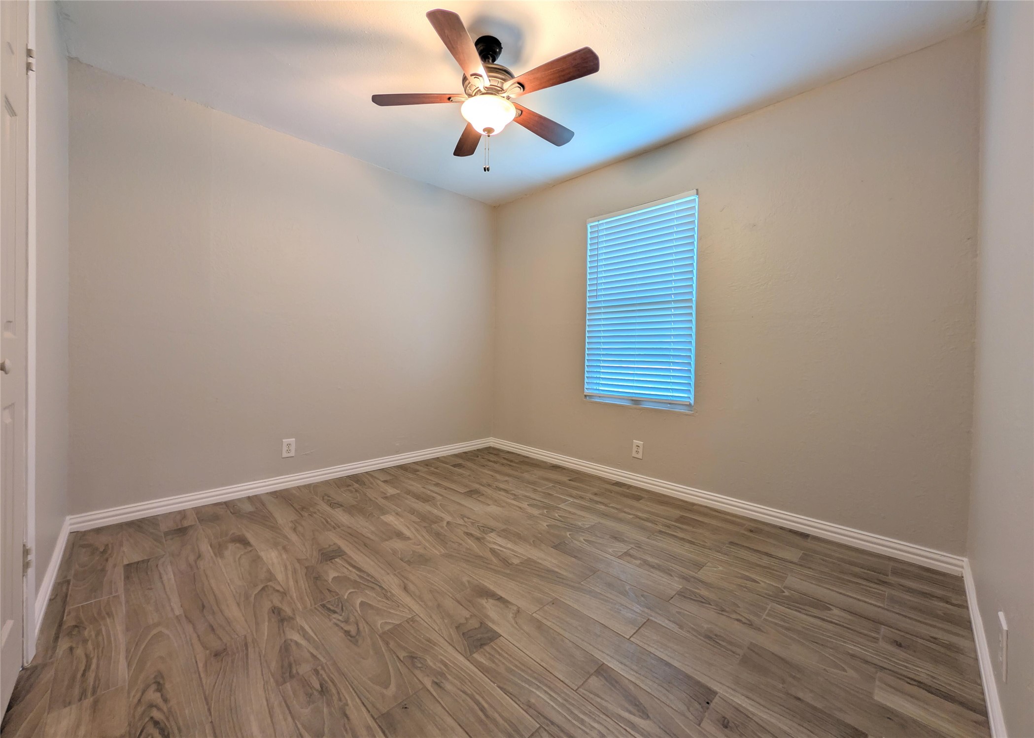 12601 Turtle Rock Road, Unit B Austin, TX 78729 - Photo 10 of 20 Bedroom 2 is on the left of the hallway