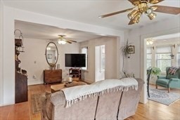 346 Townsend Road Groton, MA 01450 - Photo 21 of 43 a bedroom with bed a flat tv screen and a chandelier