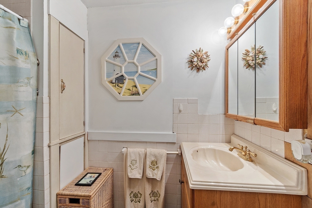 346 Townsend Road Groton, MA 01450 - Photo 23 of 43 a bathroom with a sink and a mirror