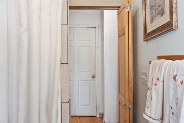 a bathroom with a shower and a curtain