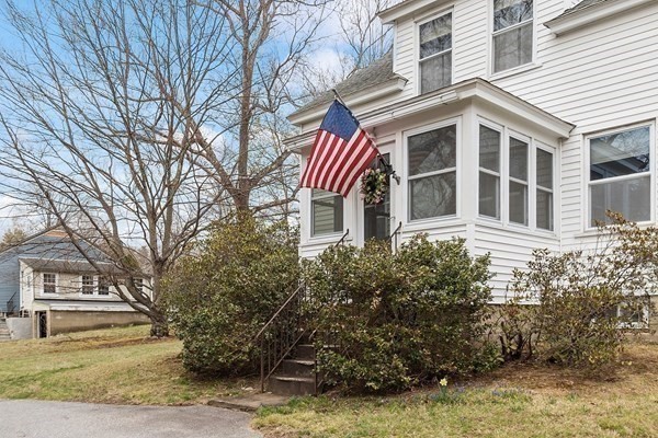 346 Townsend Road Groton, MA 01450 - Photo 3 of 43 a front view of a house with a yard