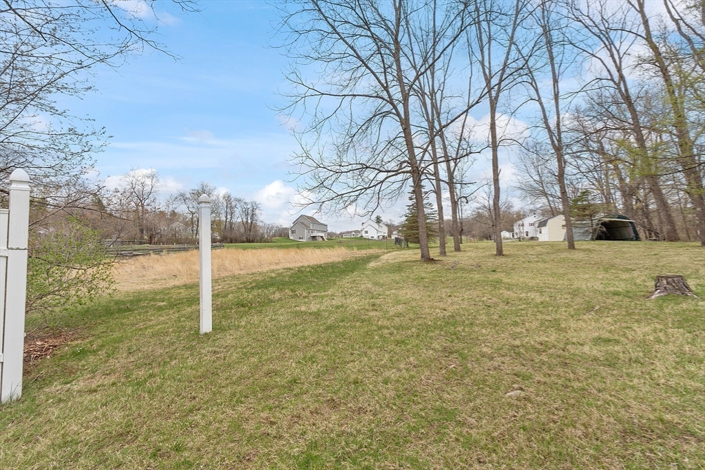 346 Townsend Road Groton, MA 01450 - Photo 37 of 43 a view of a field with trees