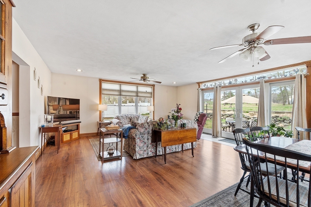 346 Townsend Road Groton, MA 01450 - Photo 9 of 43 a living room with furniture and a large window