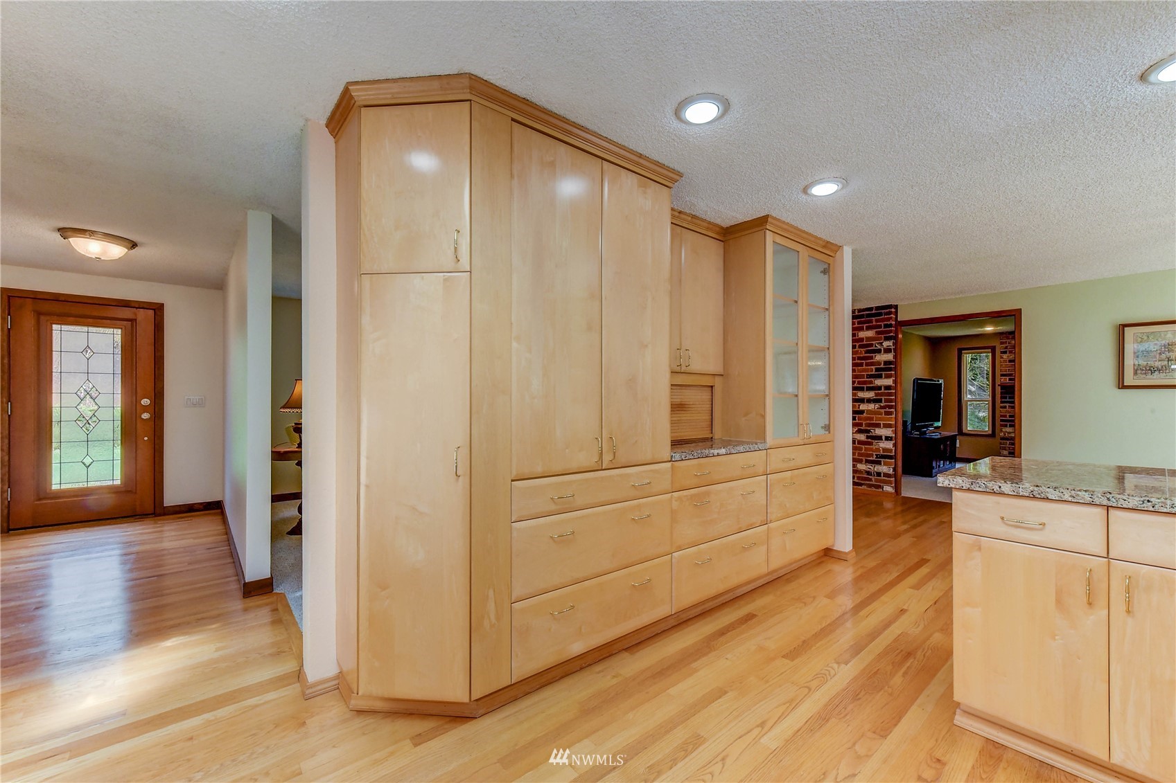 21325 9th Avenue Southeast Bothell, WA 98021 - Photo 14 of 39 a view of a hallway with wooden floor and furniture