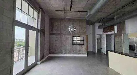 a view of a hallway with windows