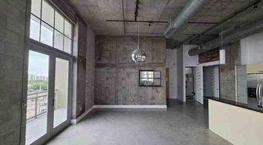 444 Northwest 1st Avenue, Unit 502 Fort Lauderdale, FL 33301 - Photo 3 of 10 a view of a hallway with windows