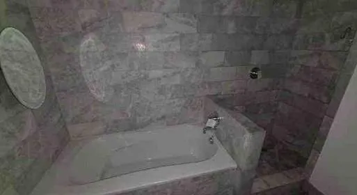 a close view of a bathtub in bathroom