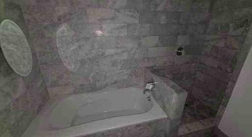 444 Northwest 1st Avenue, Unit 502 Fort Lauderdale, FL 33301 - Photo 9 of 10 a close view of a bathtub in bathroom