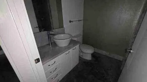 a bathroom with a sink and toilet