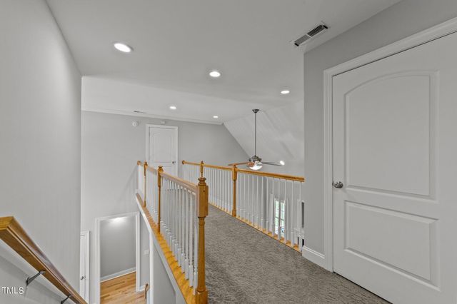 a view of a hallway with windows