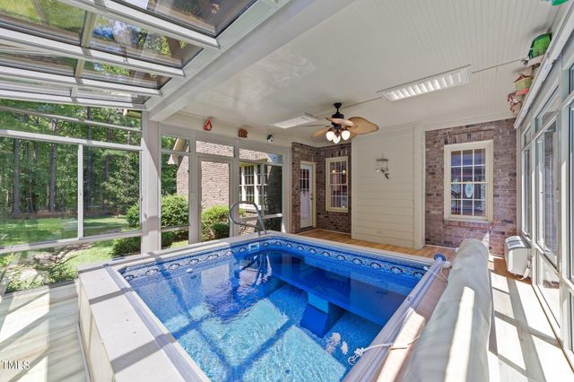 a view of a living room and kitchen with a large window