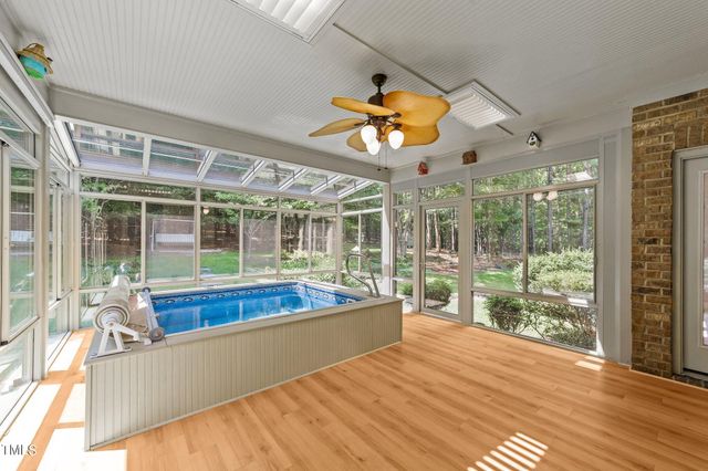 a view of a living room and kitchen with a large window