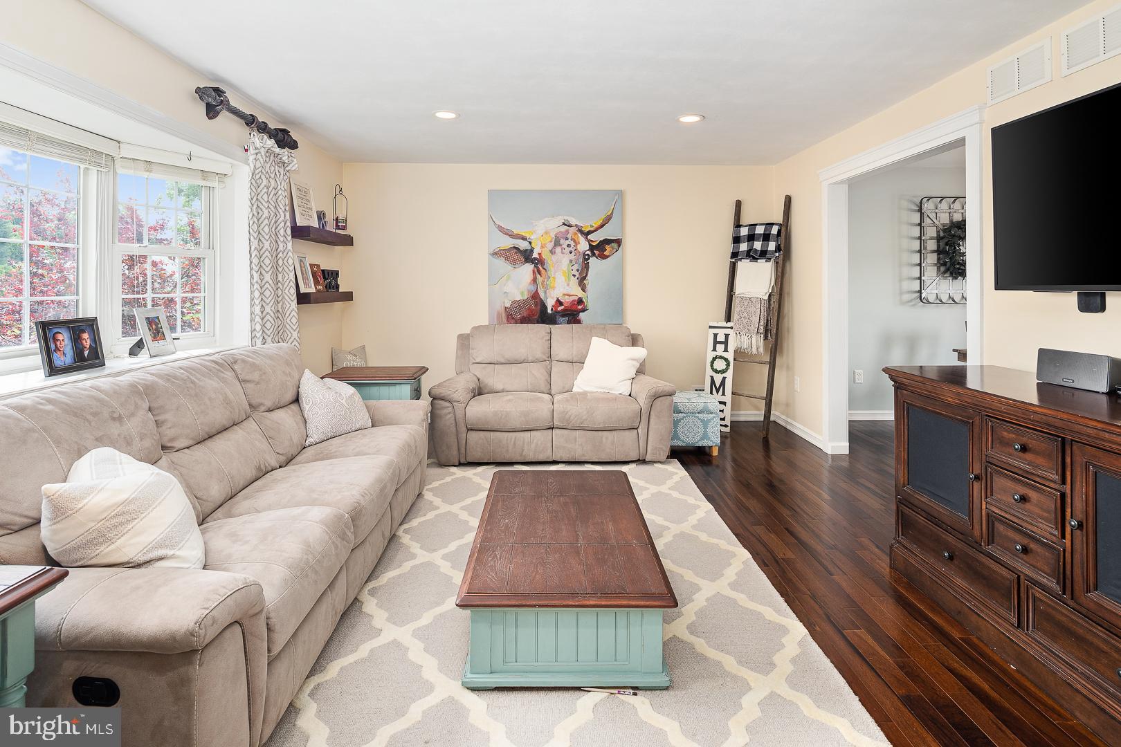 8 Valley Road Hamilton, NJ 08690 - Photo 3 of 31 a living room with furniture a flat screen tv and a large window
