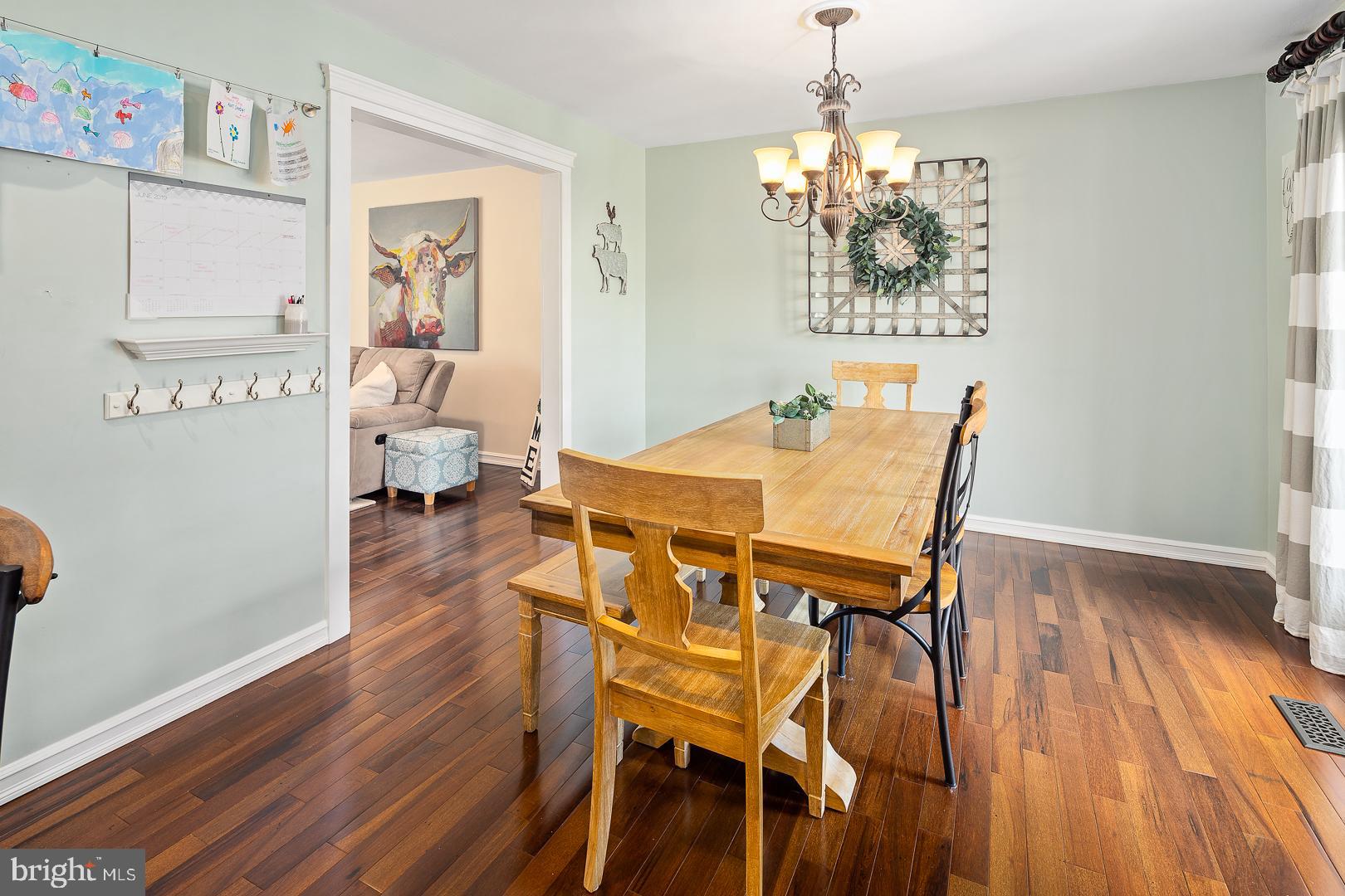 8 Valley Road Hamilton, NJ 08690 - Photo 5 of 31 a view of a dining room with furniture wooden floor and a chandelier