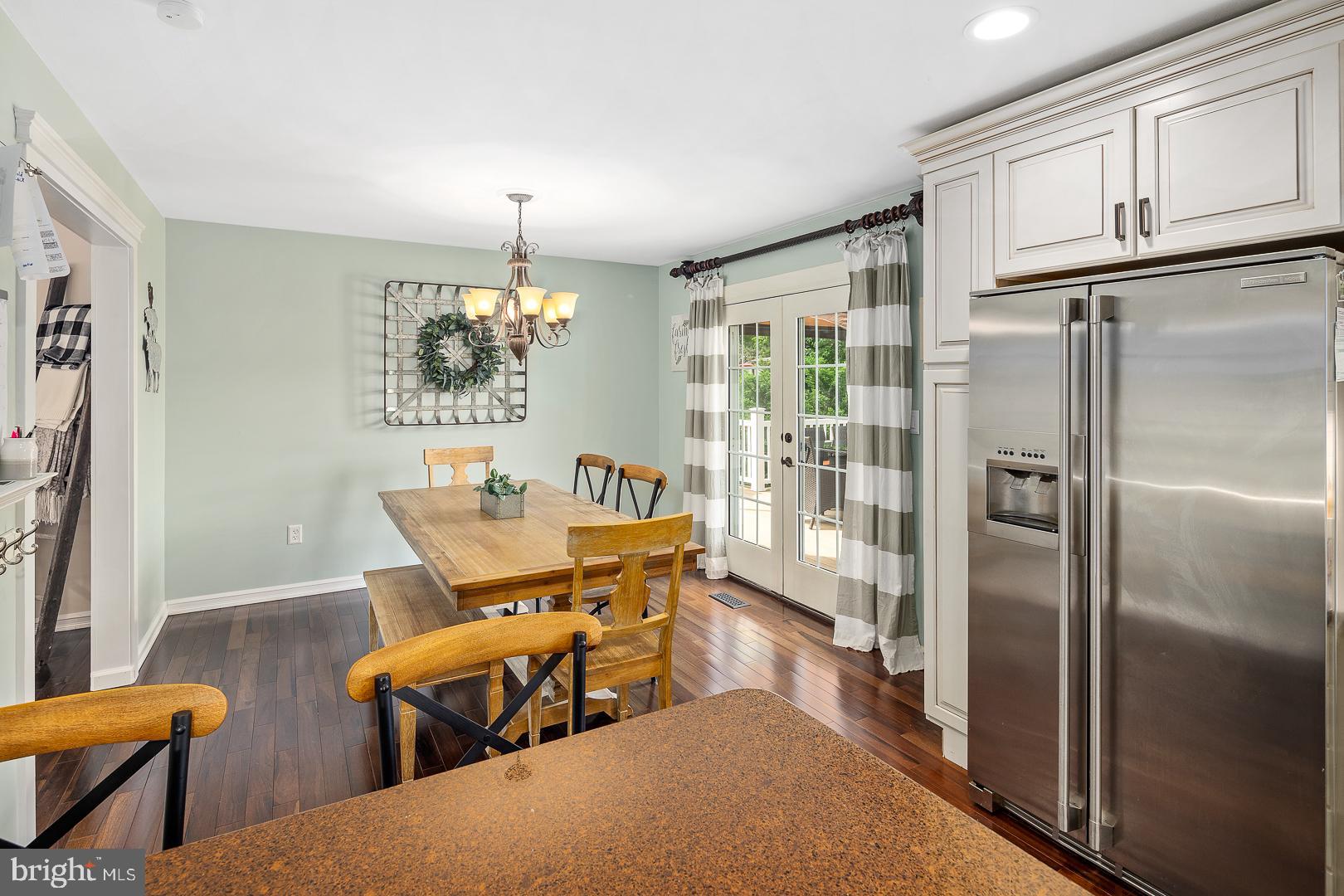 8 Valley Road Hamilton, NJ 08690 - Photo 6 of 31 a dining room with furniture a chandelier and wooden floor