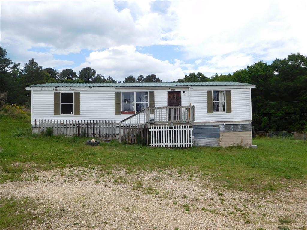 142 Ellis Road Southeast Rome, GA 30161 - Photo 1 of 19 a view of a house with a backyard and a garden