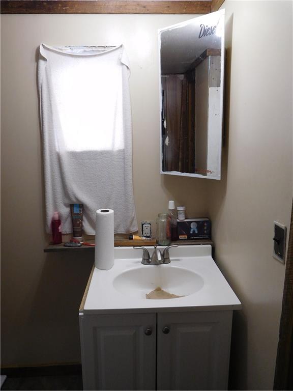 142 Ellis Road Southeast Rome, GA 30161 - Photo 13 of 19 a bathroom with a sink and a mirror