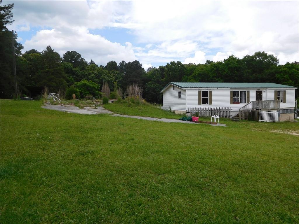 142 Ellis Road Southeast Rome, GA 30161 - Photo 2 of 19 a view of backyard of the house