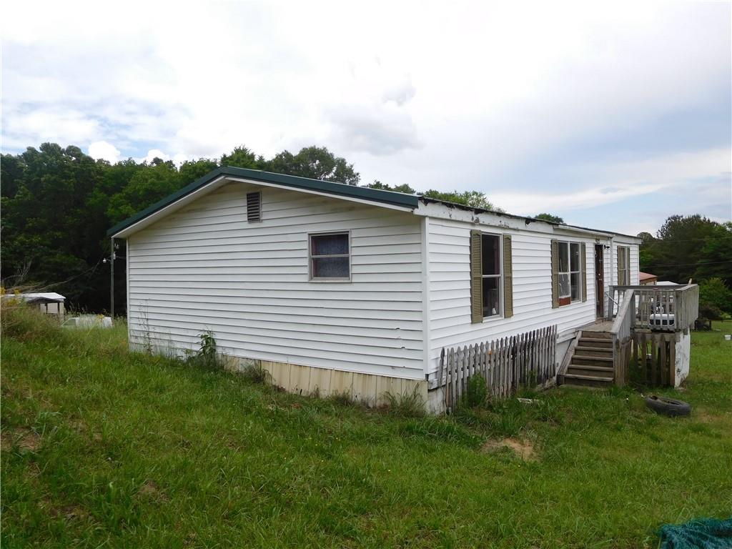 142 Ellis Road Southeast Rome, GA 30161 - Photo 3 of 19 a front view of house with a garden